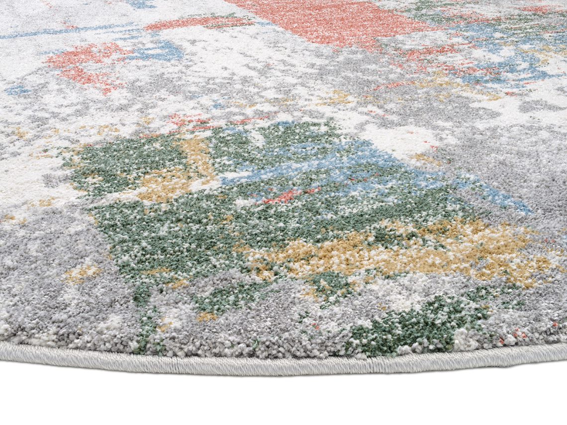 runder Teppich in pastel Farbtönen